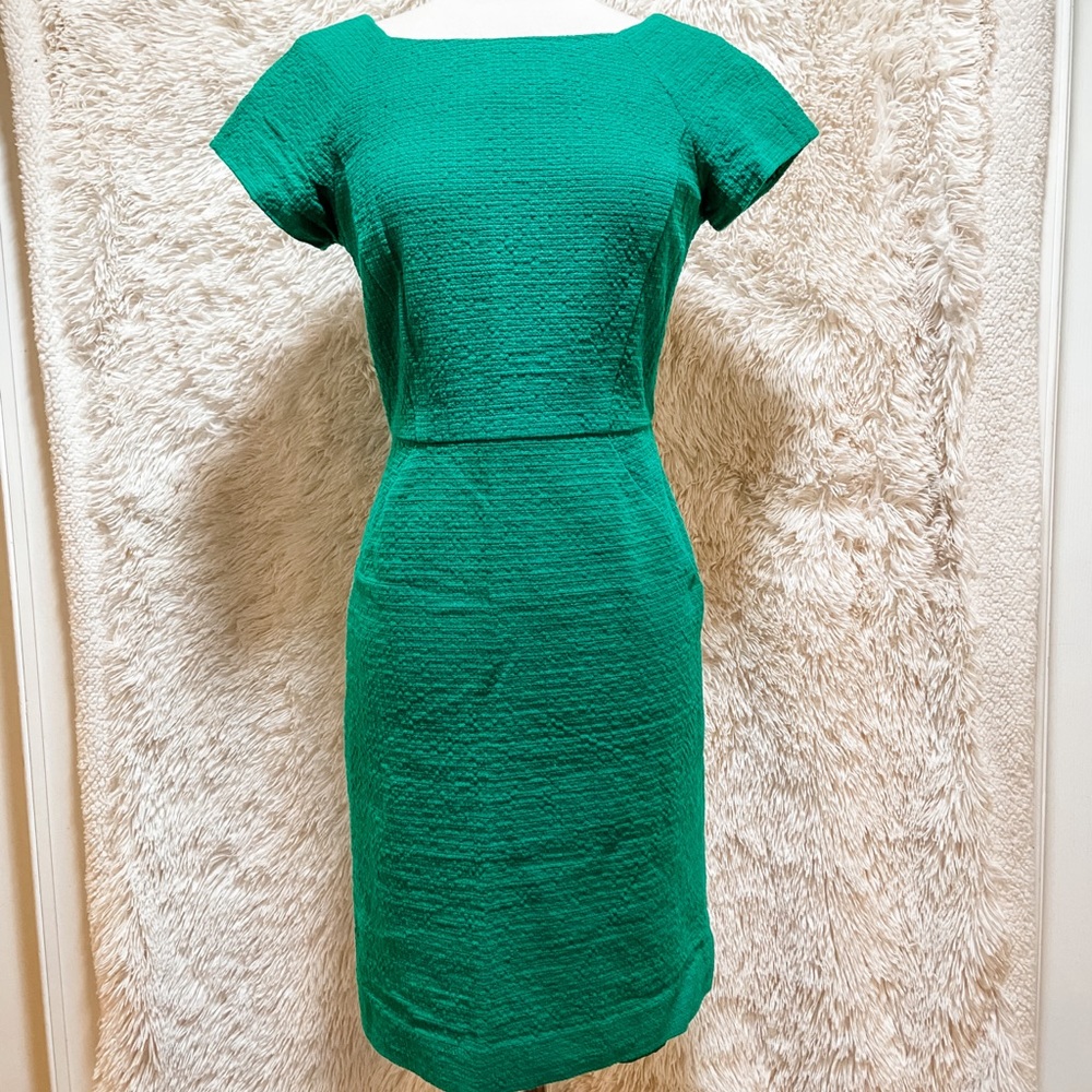 Green sheath dress with soft lining and zip back.